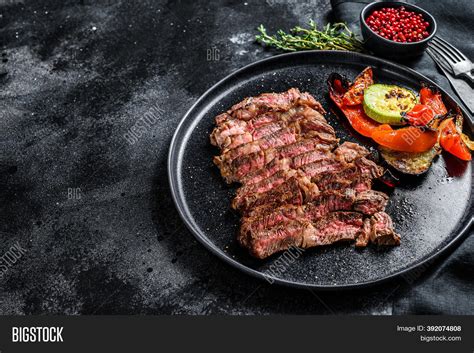 They are interchangeably called fèng zhuǎ (鳯爪, phoenix claws), jī zhuǎ (鷄爪, chicken claws), and jī jiǎo (雞脚, chicken feet). Sliced Grilled Beef Image & Photo (Free Trial) | Bigstock