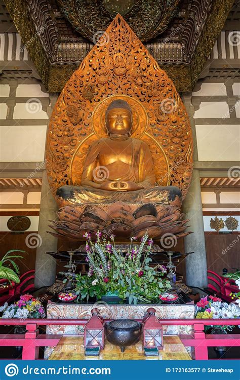 Statue Of Buddha In The Byodo In Buddhist Temple On Oahu Hawaii