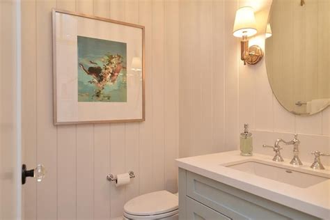 Chic Cottage Powder Room Features Shiplap Clad Walls Lined With An Oval
