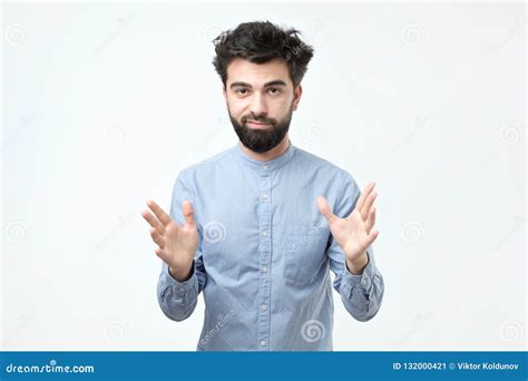 Handsome Young Man Explaining Something And Gesturing With His Hands