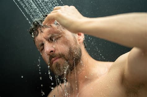 Premium Photo Man Washing Hair In Bathroom Guy Bathing Shower Head In