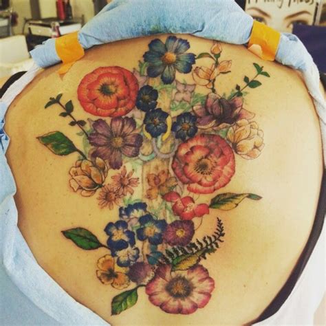 The process forms an imprint not unlike that of a fossil, preserving the pattern of the leaf or a beautiful flower forever on the body. Pressed flowers tattoo, cover up in progress | Natural ...