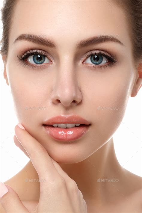 Portrait Of Young Beautiful Woman Touching Her Face Stock