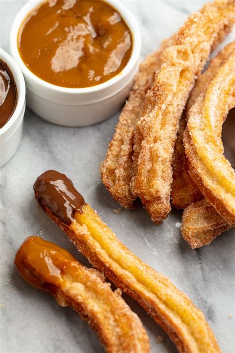 Starting at top of 1 lollipop stick and longest point of 1 dough triangle, wrap dough around stick, twisting dough as you go, until all of dough is around stick. Churro Recipe 4 - thestayathomechef.com