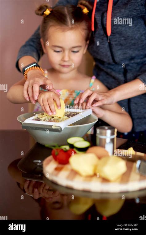 Cute Little Girl And Mother Cooking At Home Stock Photo Alamy