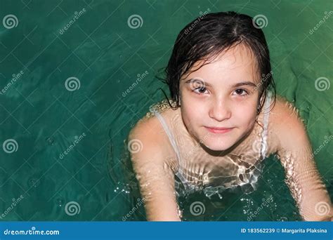A Teenage Girl In The Pool Swims To The Side Stock Image Image Of