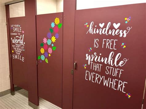 The Bathroom Stalls Are Decorated With Flowers And Sayings For Free