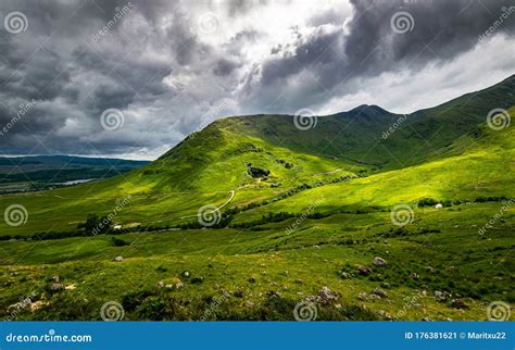 Scenic Scottish Valley In Summer With Dramatic Overcast Sky Stock