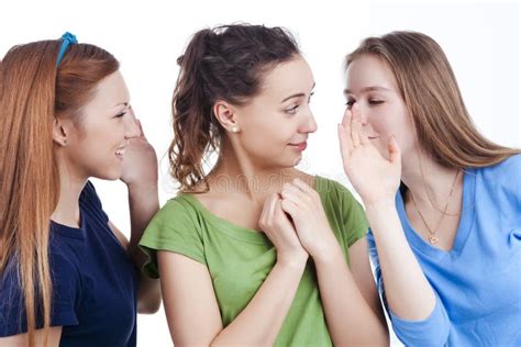 Three Young Positive Caucasian Girlfriends Sharing Their Secrets