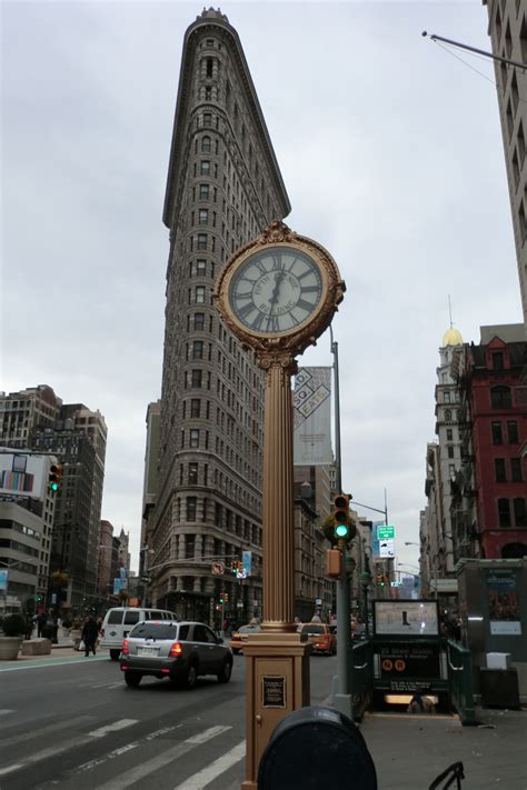 Manhattan Ny Fifth Avenue Building Clock And The Flatiron Building