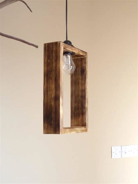 Amazing gallery of interior design and decorating ideas of lantern pendant in bedrooms, living rooms, decks/patios, dining rooms, laundry/mudrooms, bathrooms, kitchens, boy's rooms, entrances/foyers by elite interior designers. Cute Minimal Wooden Pendant Lighting shade - iD Lights