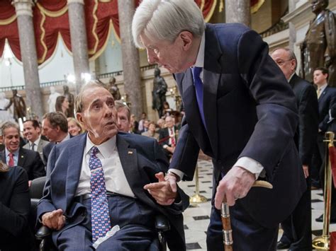 Family and a crowd are standing behind bob dole. Bob Dole to be presented with Congressional Gold Medal ...
