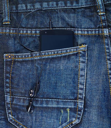 Smart Phone In A Back Pocket Of A Jeans Stock Photo