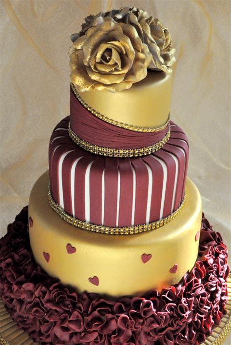 Nothing complements the warm rich tones of rose gold like a rich burgundy the color of fall leaves, and it just so happens that this particular palette channels two 2013 wedding. Gold And Burgundy Wedding Cake With Ruffles And Roses ...
