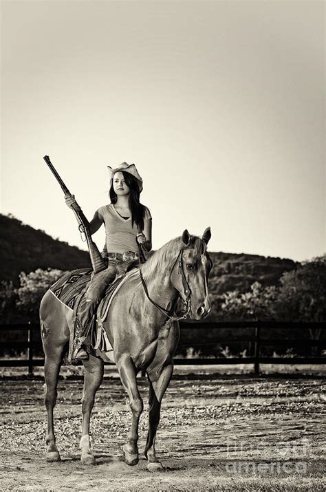 Cowgirl With Rifle Riding On Horseback Photograph
