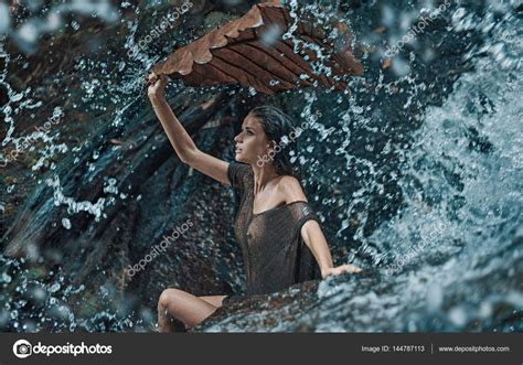 Beautiful Brunette Woman Enjoying The Tropical Waterfall Stock Photo By