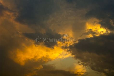 A Bright Orange Gray Storm Clouds In A Dark Sunset Sky Rain Clouds In