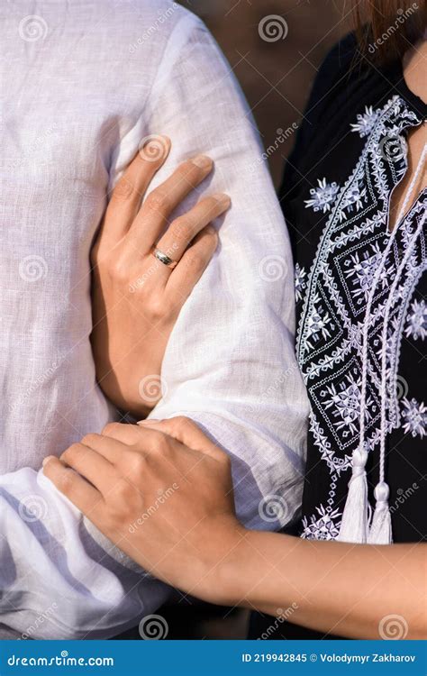 Couple Holding Hands Young Woman Holding Man`s Arm Tenderly Stock Image Image Of Embrace