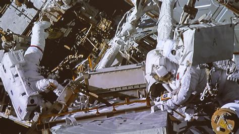 Spacewalking Astronauts Complete Space Station Battery And Cable Work BT