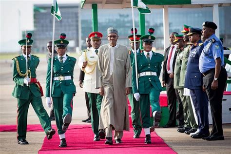Photos See How Nigerians Welcom President Buhari As He Arrives Back To