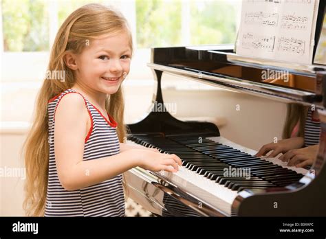 Young Girl Playing Piano Stock Photo Alamy