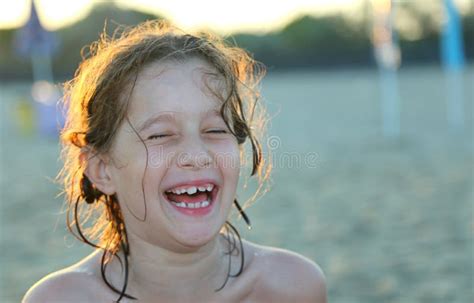 Smiling And Pretty Little Girl On The Sea Beach In Summer Stock Image