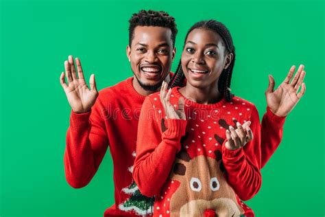 Happy African American Couple In Red Christmas Sweaters Smiling And