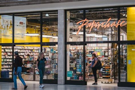 People Walking Past Paperchase Shop Inside Victoria Station In London