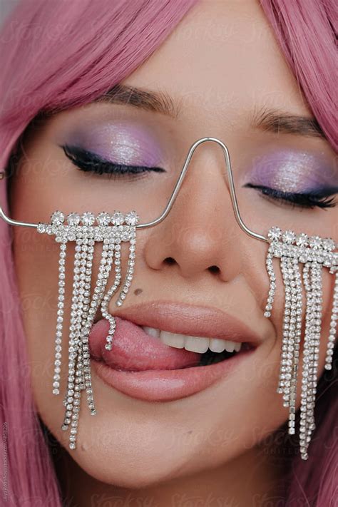 Pretty Woman With Make Up Licking Crystals By Stocksy Contributor