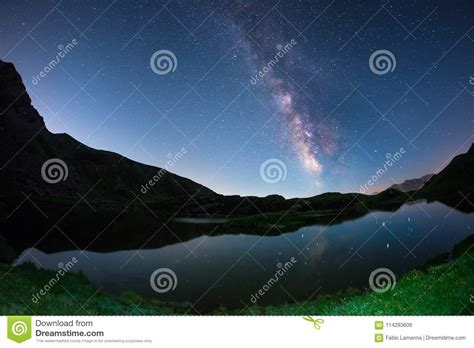 Milky Way Arch And Starry Sky Reflected On Lake At High Altitude On The
