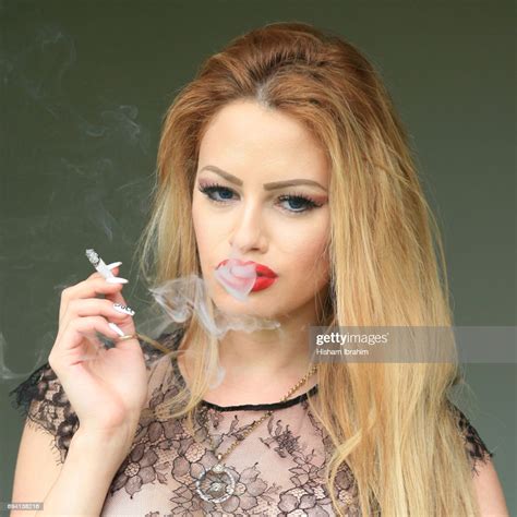 Glamorous Young Beautiful Latin Woman Smoking Cigarette
