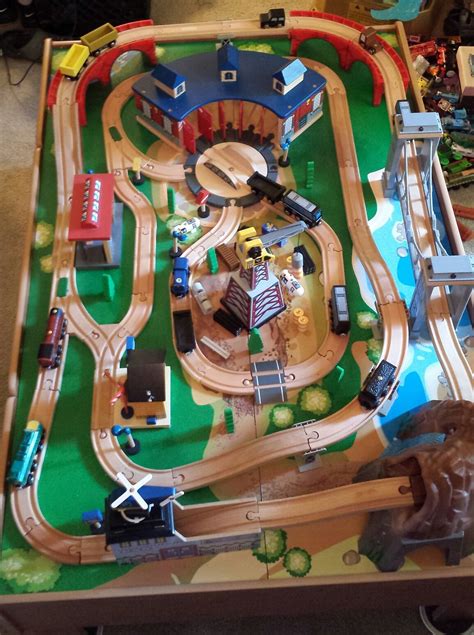 Hape e3766 70 piece railway train table and set toy with battery powered locomotive with removable playmat surface and storage for kids 3 years and up. https://post.craigslist.org/k/_hvi1aNK4xGjKcc4CvZLwQ?s ...