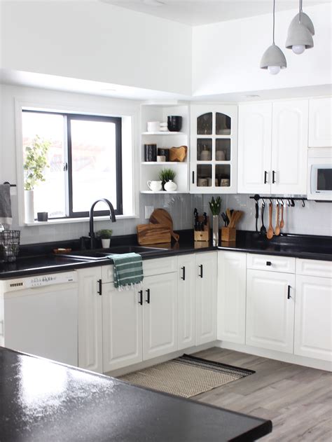 Installing new cabinets and countertops will upgrade the entire look of your kitchen. White Kitchen Cabinets with Black Countertops Are the Next ...
