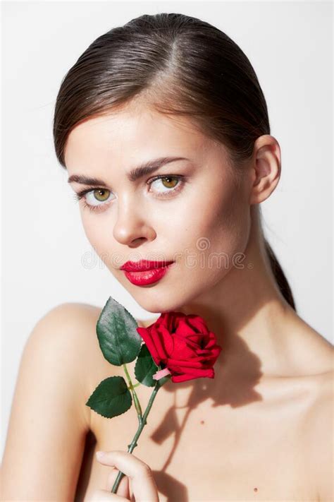 Brunette With A Rose Bare Shoulders Forward Glance Red Lips Stock Photo