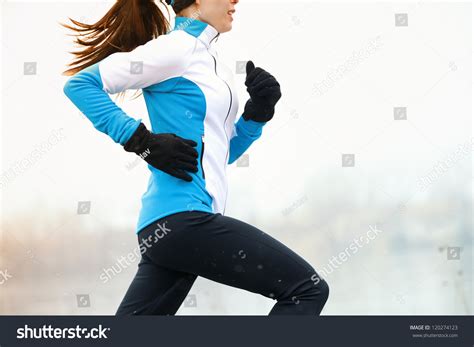 Running Athlete Woman Sprinting During Winter Stock Photo 120274123