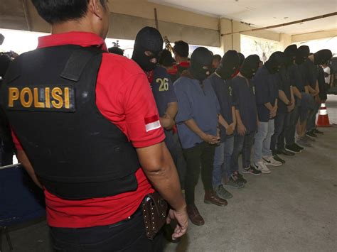 indonesian police raid gay sauna and arrest dozens as crackdown on homosexuality continues the