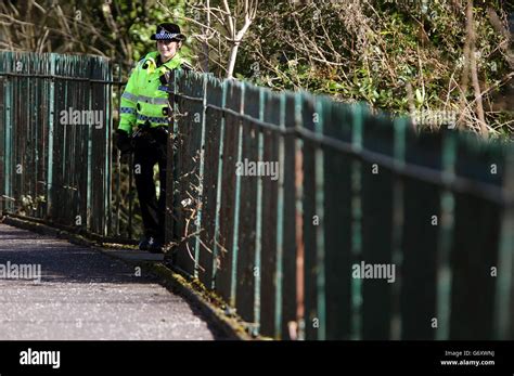 a police officer at a section of dean park in kilmarnock ayrshire where officers are searching