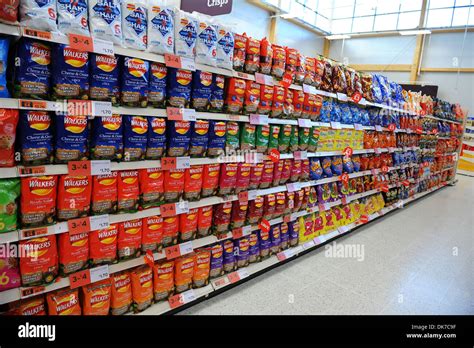 Supermarket Interior Showing Packets Of Crisps Britain Uk Stock Photo