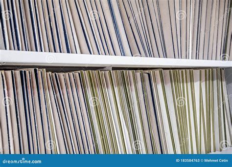 Rows Of File Folders Arranged On Shelf With Client Data In Office