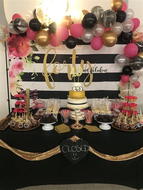 Pink black and gold candy table with balloon garland | Pink and gold