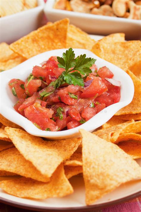 Learn how to make nachos chips at home with this easy and quick recipe. Nachos Corn Chip And Fresh Salsa Stock Photo - Image of ...