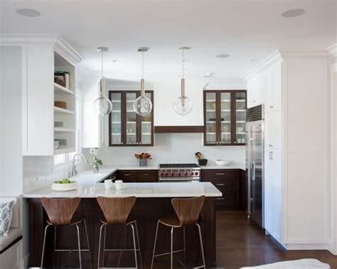 The transitional style inspired kitchen features black painted walls, jet black granite countertop, medium tone tile flooring and globe pendant lighting fixtures over a curved peninsula. The Basic Designs of Peninsula Kitchen Layout - Home Decor ...