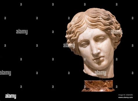 Close Up On Broken Head Of Ancient Roman Statue Of Sad Woman Stock
