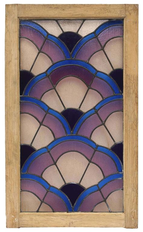An Art Deco Stained Glass Window With Blue And Purple Designs On The Outside Framed In Wood