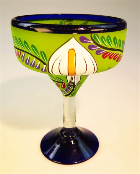 This unmistakable glassware style is strengthened with a sturdy stem, perfect for a formal setting, or for playing a bartender at home. Mexican glass margarita set with pitcher and rack