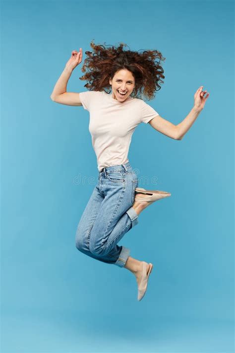 Young Joyful Brunette Woman Leaping In Isolation Stock Image Image Of