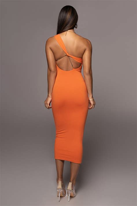 chic with a touch of edge our orange meara one shoulder dress showcases a sleek body con