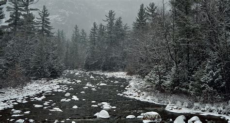 Winter First Snow Scenery With Mountain River In White