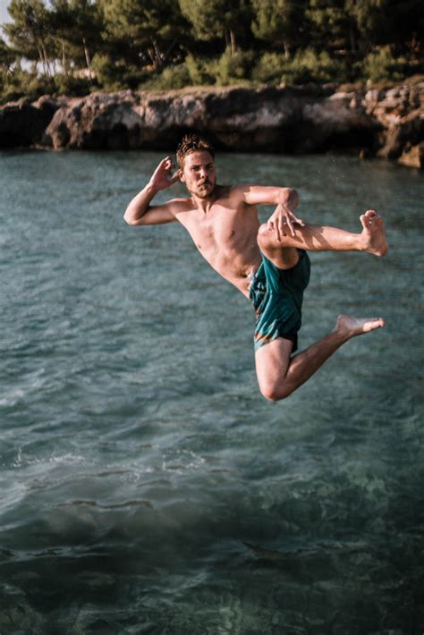 Man Jumping On Bodies Of Water · Free Stock Photo
