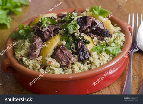Serve it with couscous for the best exotic experience. Traditional Moroccan Beef Tagine With Couscous Stock Photo ...